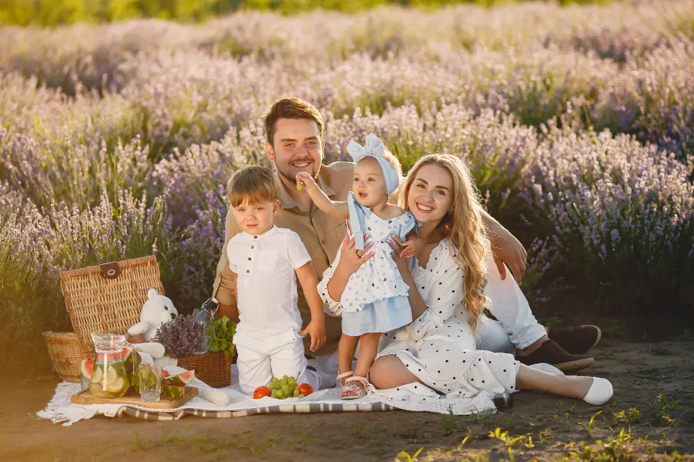 family-lavender-field-people-picnic-mother-with-children-eats-fruits
